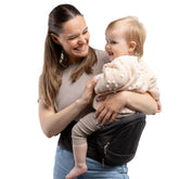 Beco Foldable Hip Seat Carrier worn front-facing for active exploration and bonding moments.