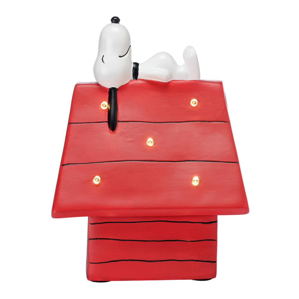 Bedtime Originals Snoopy dog house night light shines softly for bedtime.