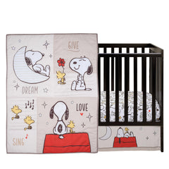 Bedtime Originals Snoopy Love quilt design features Snoopy and stars in cozy print.