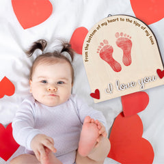 Beeveer Valentine's Heart Footprint Art Sign in nursery decor setting.