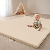 Bella’s Friends foldable play mat folded with handles for easy travel.