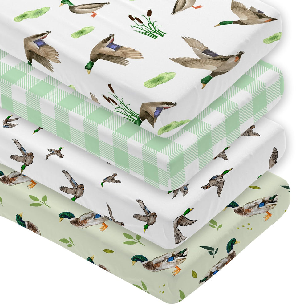 Besaomeom 4-pack mallard duck crib sheets show snug fit with elastic edges.