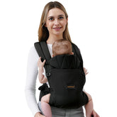BethBear baby carrier front-worn on a newborn for close bonding and comfortable skin-friendly carry.