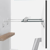 Bezant metal TV safety straps attached to wall securing a flat-screen.