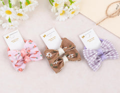 BIANHUAN baby girls hair accessories bows on elastic bands for gentle hair management.