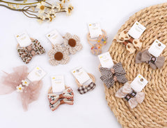 BIANHUAN small-size hair ties with bows shown on toddler-friendly hair