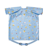 BIBaDO coverall bib on a baby at mealtime keeps outfits clean.