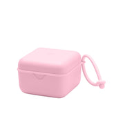 BIBS pacifier box with strap on-the-go storage keeps pacifiers organized and accessible.