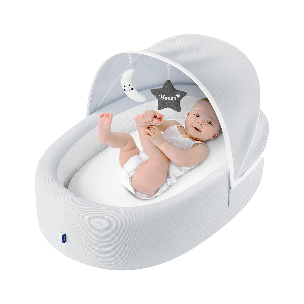 Biliboo premium portable baby lounger with mesh canopy for breathable newborn comfort on the go.