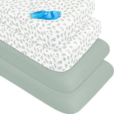 Biloban crib sheets folded with green leaf design for a snug fit