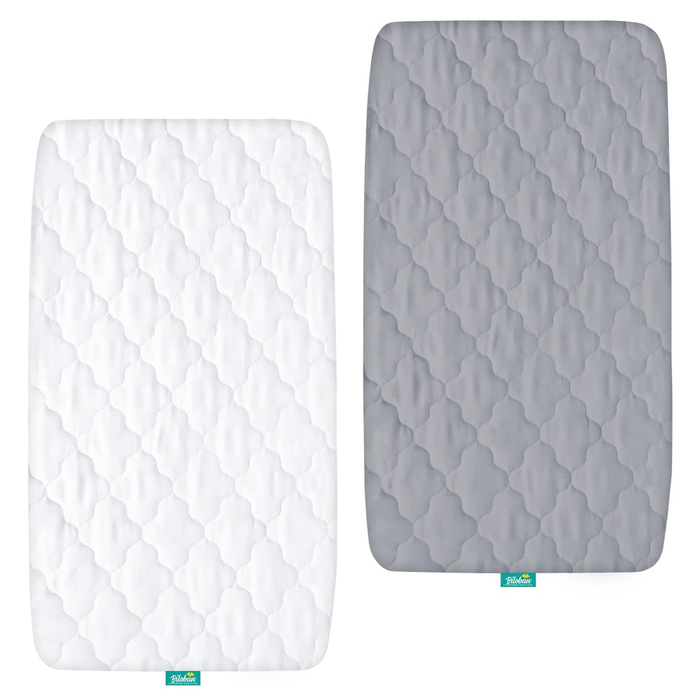 Biloban bassinet mattress pad cover close-up shows quick-fit elastic edge for easy mounting