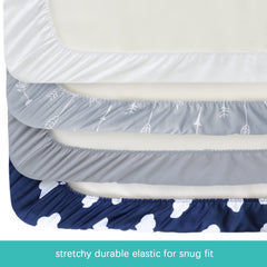 Biloban bassinet sheets show full-edge elastic for secure hold.