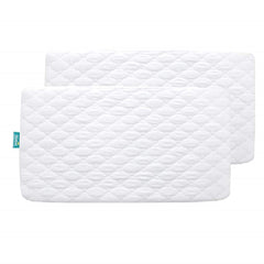 Biloban crib mattress protector fitted to 52x28 mattress for secure spill protection.