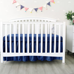 Biloban navy crib skirt corner buttons ensure secure fit
