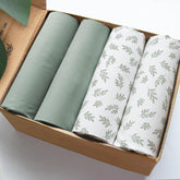 Biloban mini crib sheet Aqua Leaf on standard mattress provides a snug fit for peaceful sleep.