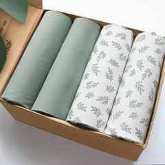 Biloban mini crib sheet Aqua Leaf on standard mattress provides a snug fit for peaceful sleep.
