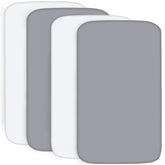 Biloban pack-and-play sheets in gray and white on a mattress provide a snug, safe surface.