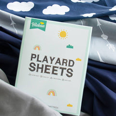 Biloban navy cloud fitted sheet on mattress shows secure fit for restless sleepers