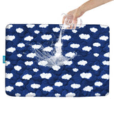 Biloban Pack N Play Mattress Protector Navy Cloud neatly folded for quick setup and playtime comfort.
