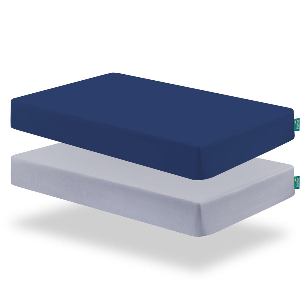 Biloban pack and play fitted sheet on mattress for secure fit.
