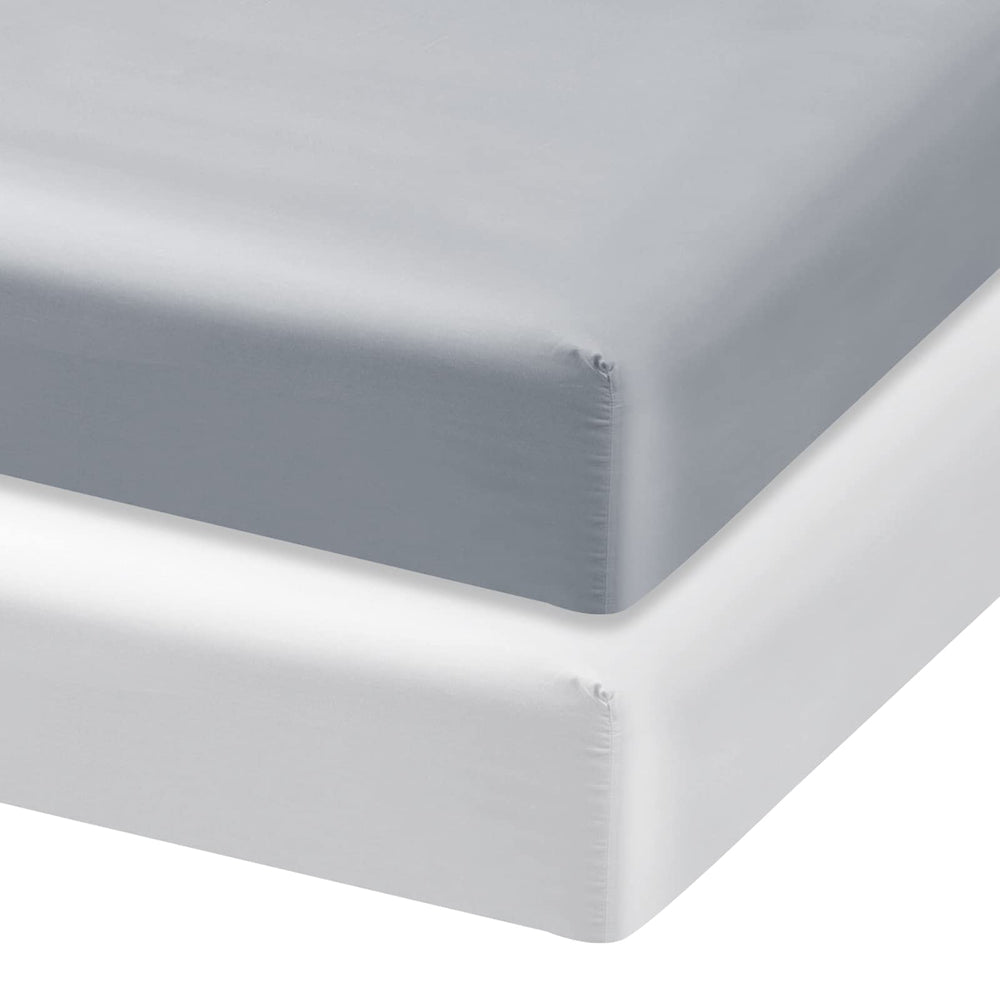 Biloban satin crib sheets close-up fabric shows smooth texture for cool, gentle sleep.