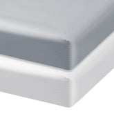Biloban satin crib sheets close-up fabric shows smooth texture for cool, gentle sleep.