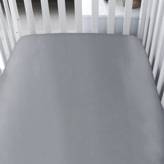 Biloban satin crib sheets with elastic-band fit demonstrate snug, secure corners for a flat, cozy mattress.