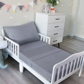 Biloban toddler sheet set fitted sheet on crib mattress for a secure, wrinkle-resistant fit.