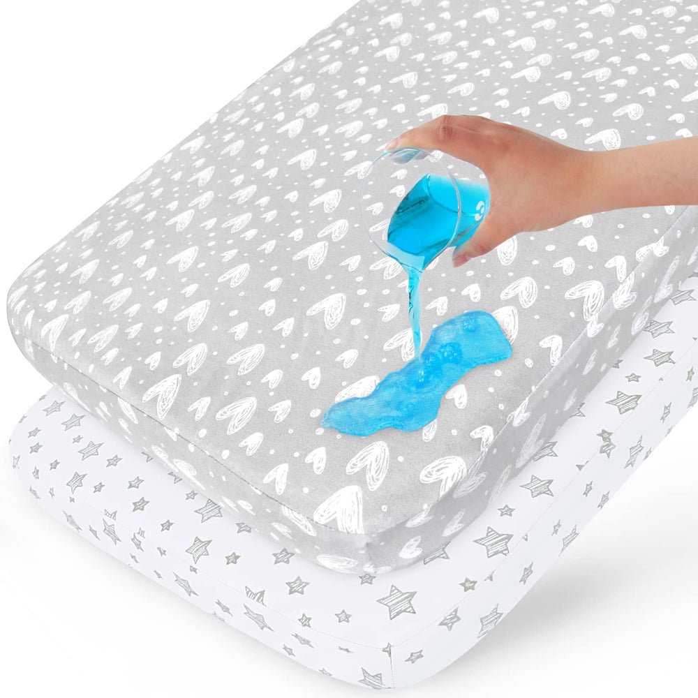 Biloban waterproof crib mattress protector 2-pack shows a snug fit protecting crib.