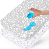 Biloban waterproof crib mattress protector 2-pack shows a snug fit protecting crib.