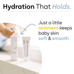 BioGaia Baby Probiotic Ointment on cheek during application for sensitive skin care.