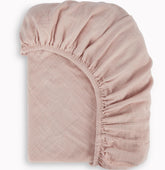 BIOWEAVES bassinet sheet soft muslin close-up shows breathable fabric for newborn comfort