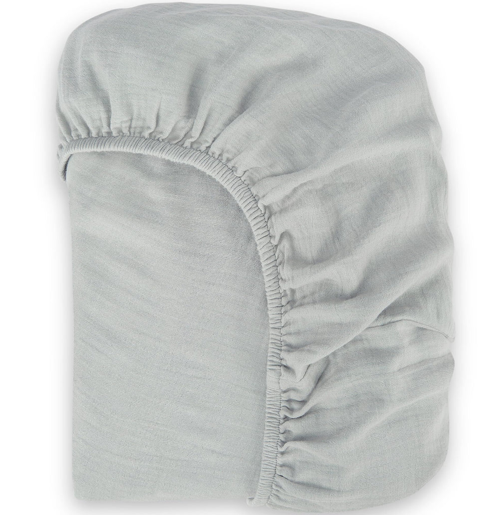 BIOWEAVES organic muslin cotton sheet closeup shows soft, breathable fabric for delicate baby skin