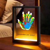 Bixinyo Family Handprint Kit light frame shows cozy nursery keepsake.