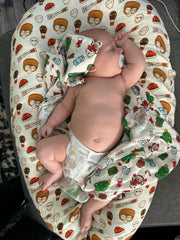 BlessEver muslin swaddle emoji-print design adds playful visuals during cuddles.