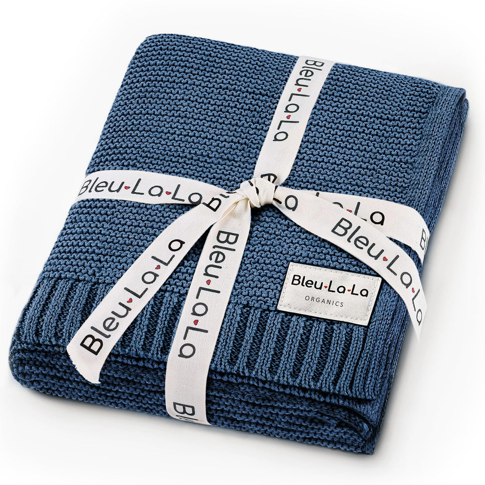 Bleu La La Heritage Knit swaddle in denim blue offers soft organic cotton for newborn comfort.