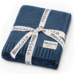 Bleu La La Heritage Knit swaddle in denim blue offers soft organic cotton for newborn comfort.
