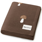 Bleu La La knit baby blanket mushroom mocha fabric close-up shows buttery-soft cotton for newborn comfort.
