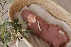 Bleu La La Luladream blush pink pacifier on soft surface for comforting moments