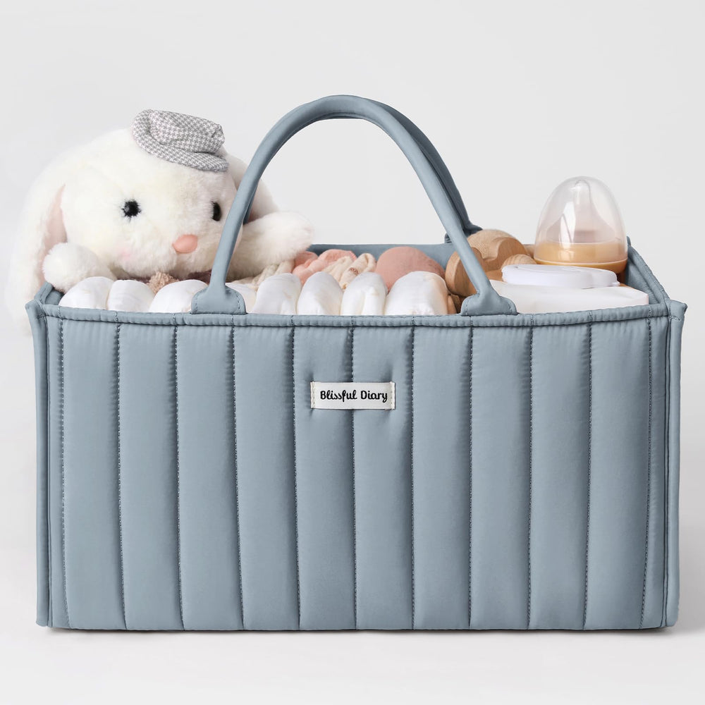 Blissful Diary diaper caddy in dusty blue on a changing table for easy access to newborn essentials.