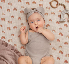 Blissful Diary elastic fit closeup highlights secure pack n play sheet with snug elastic