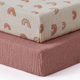 Blissful Diary muslin crib sheet dusty-pink on mattress delivers breathable comfort for baby sleep.