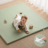 Blissful Diary vegan leather play mat closeup shows cushioned foam for comfortable tummy time.