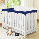 Blue-jxt crib rail cover wrapped around a crib rail for teething protection.