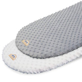 BlueSnail bassinet sheet folded in white and gray shows soft, cozy minky fabric.