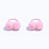 BOENBE LOVED pink pom-pom hair ties provide gentle hold for toddler ponytails.
