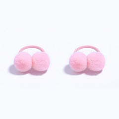 BOENBE LOVED pink pom-pom hair ties provide gentle hold for toddler ponytails.