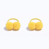 BOENBE LOVED baby hair ties yellow pom pom closeup highlighting soft, gentle hold for tiny ponies