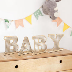 Boho rattan baby letters used in nursery decor for cozy bohemian vibe.