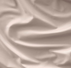 Boll & Branch Signature Hemmed Crib Sheet on mattress; secure fit with topstitched elastic for peaceful nights.